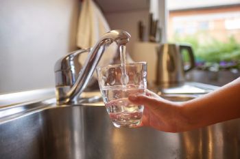 Child Getting Glass of Water