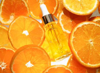 Facial serum in glass bottle with vitamin C